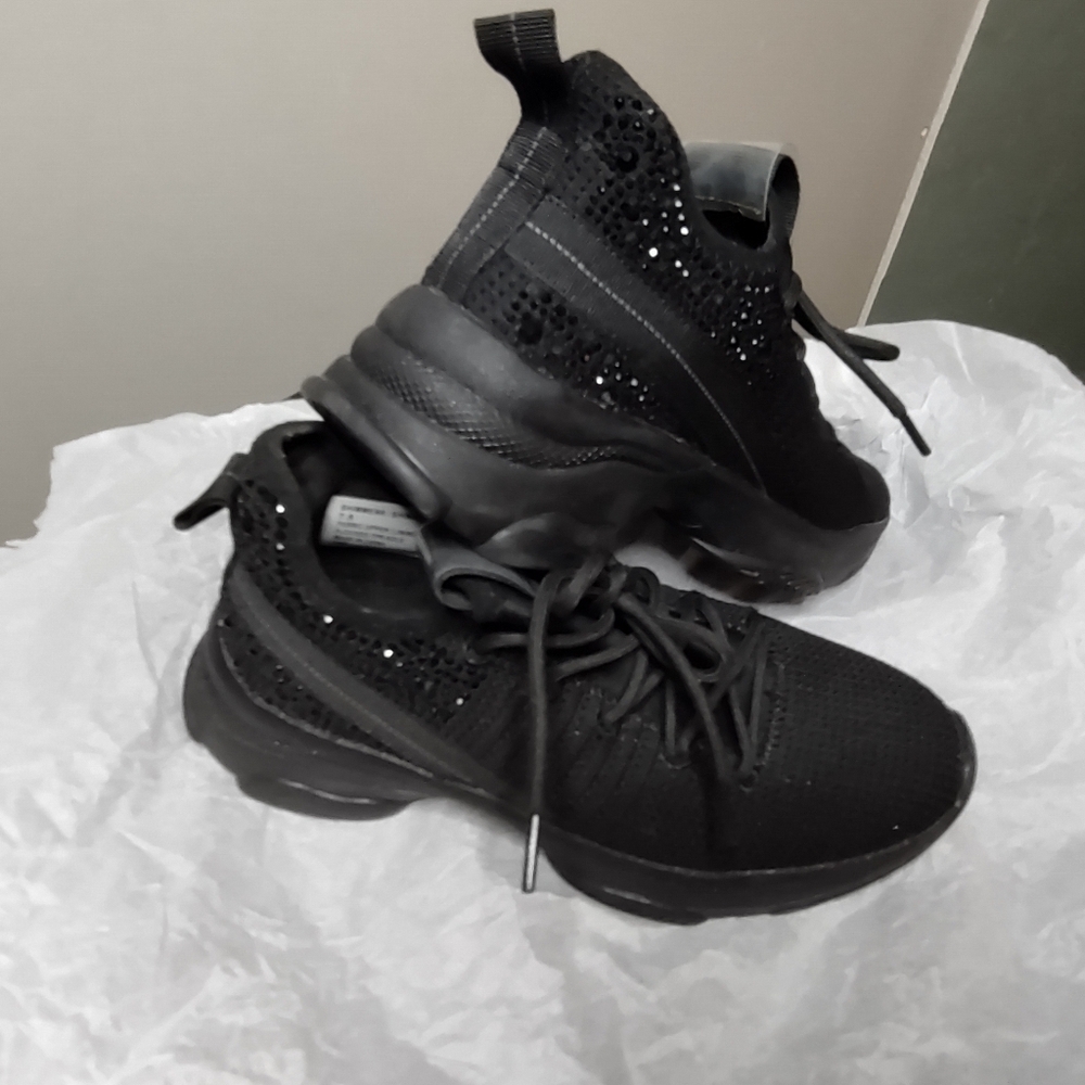 Madden girl black switch sparkle embellishments on the back.  7 1/2